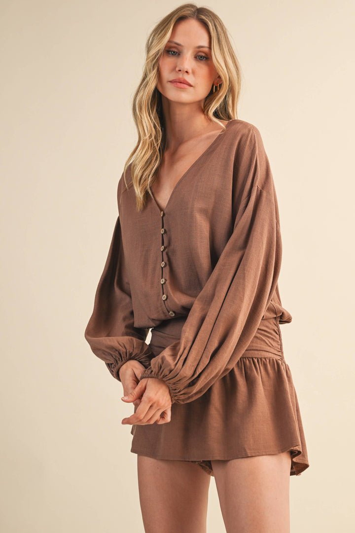 LINEN LONGSLEEVE BUTTON AND SMOCKED WAIST ROMPER - Rompers