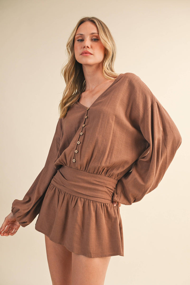 LINEN LONGSLEEVE BUTTON AND SMOCKED WAIST ROMPER - Rompers