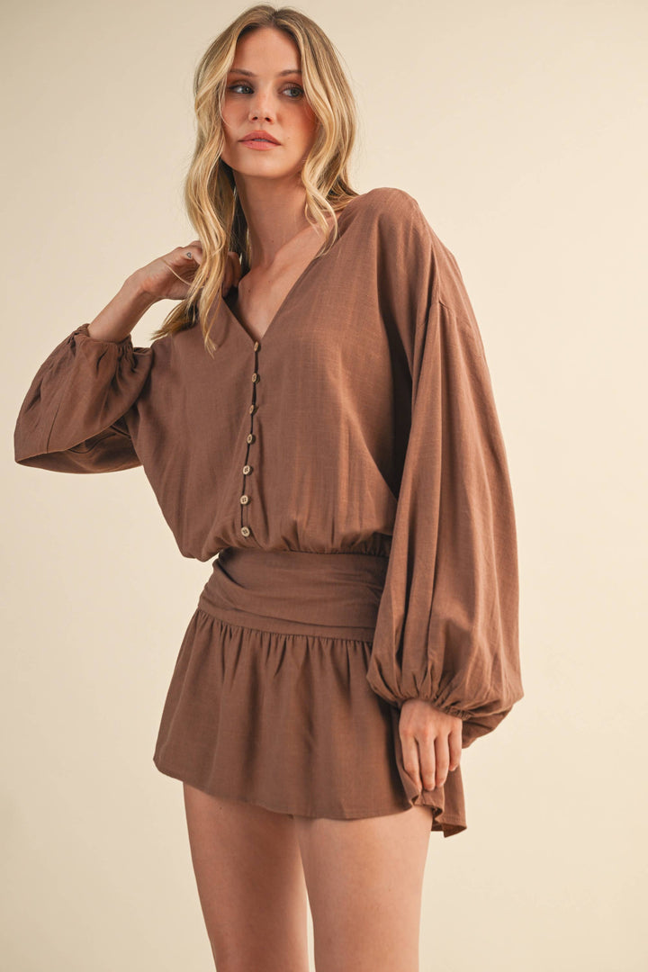 LINEN LONGSLEEVE BUTTON AND SMOCKED WAIST ROMPER - Rompers